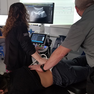 image Carrolltown chiropractic ultrasound imaging of spinal vertebrae during treatment